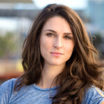 Youthful brunette headshot serious expression