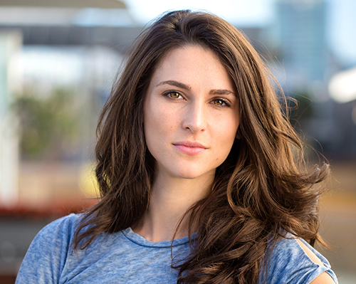 Youthful brunette headshot serious expression