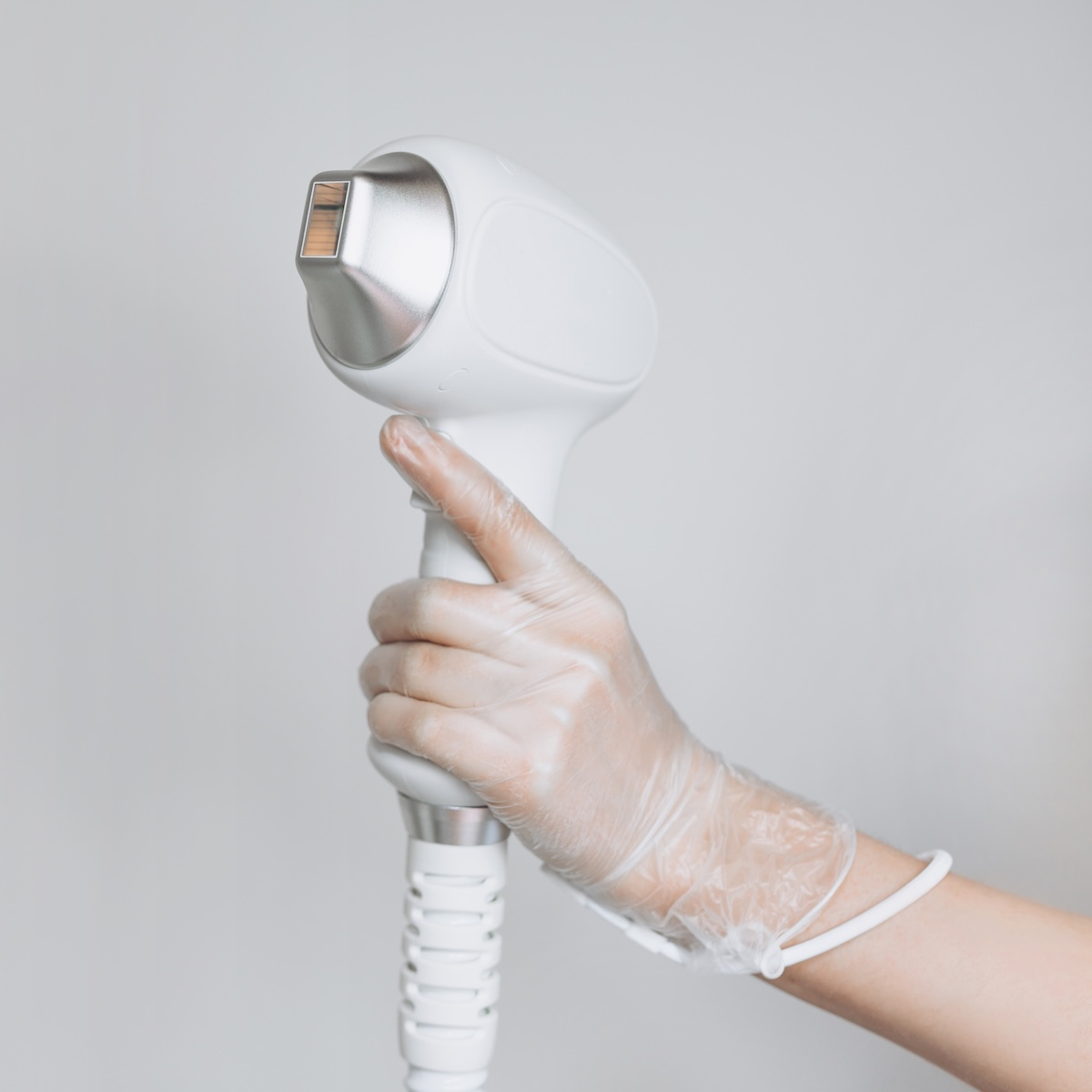 esthetician holding laser