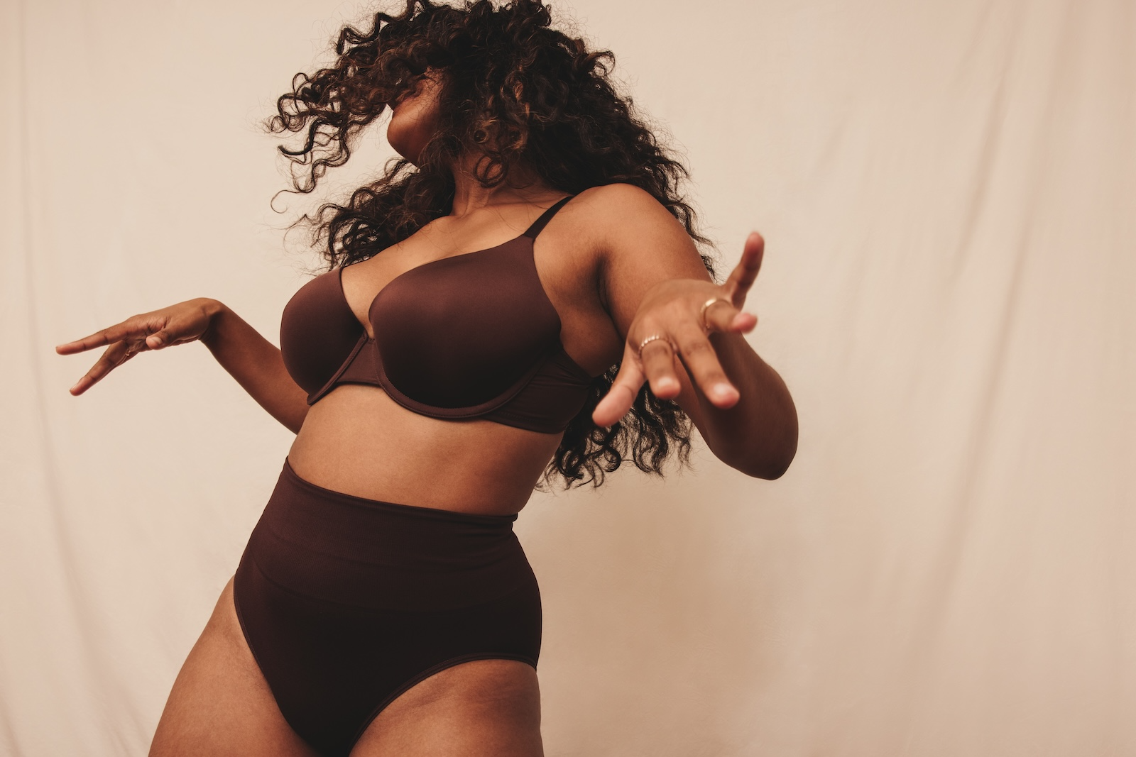 woman in brown lingerie dancing