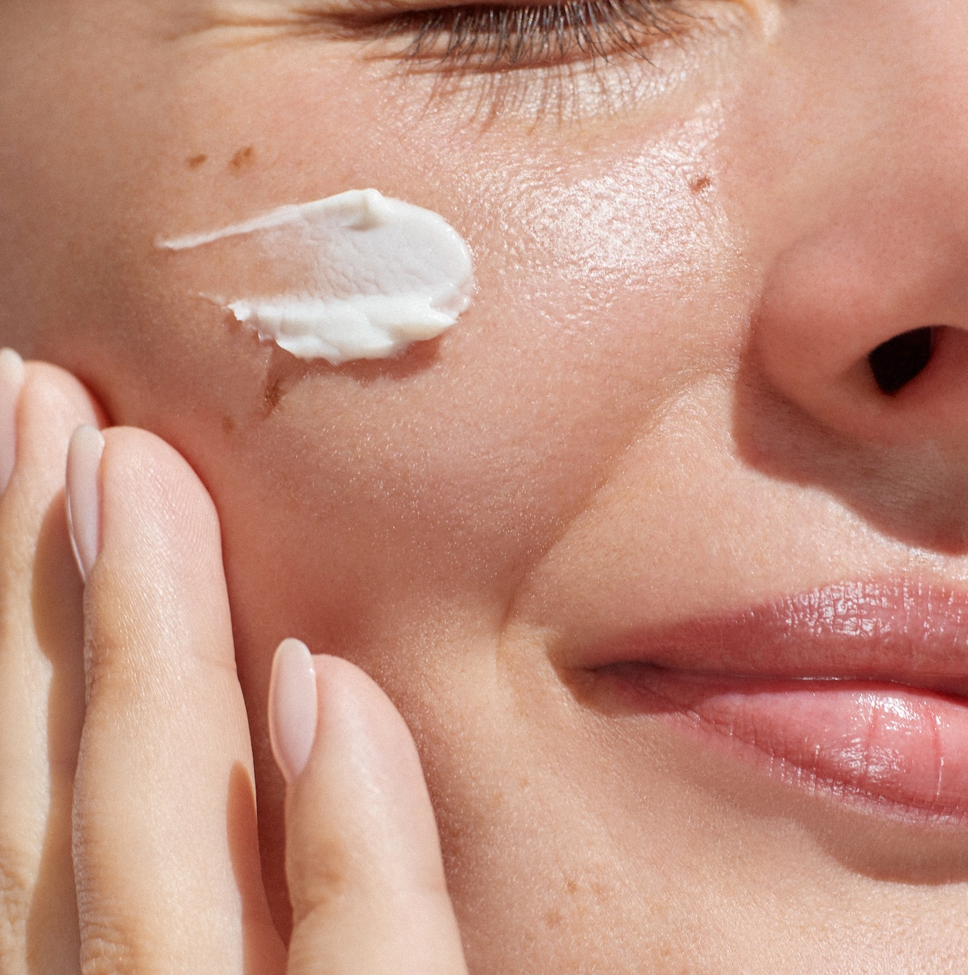 woman with skincare swipe on her face